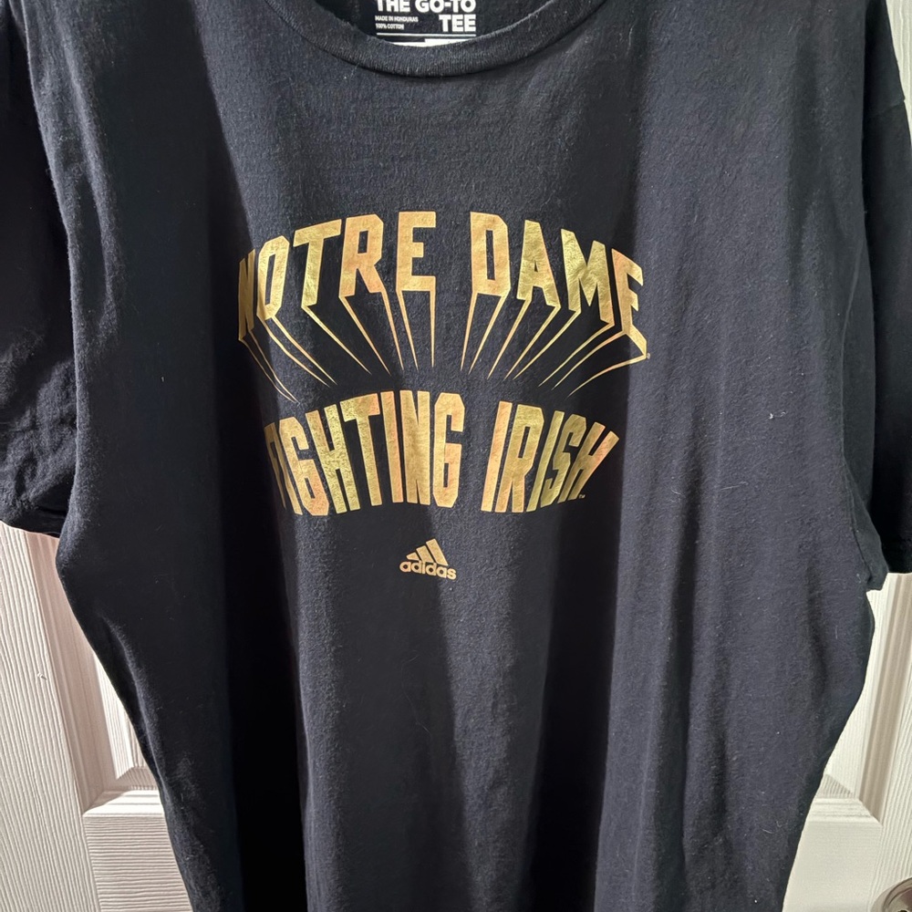 Adidas Black Tee with Gold Notre Dame Graphic